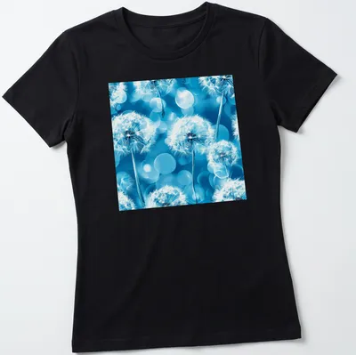 Boho-style T-shirt with white dandelion flowers on aqua blue background — printed on a women's shirt