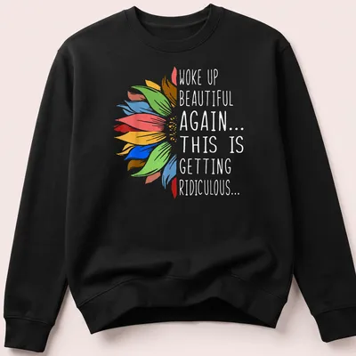 Humorous t-shirt with sunflower and vibrant text about waking up beautiful. — printed on a unisex sweatshirt