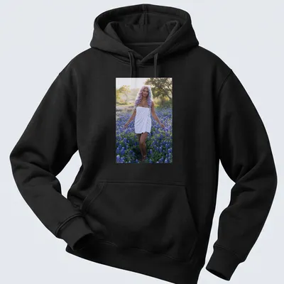 Photographic T-shirt featuring a woman in white dress among bluebonnet flowers — printed on a unisex hoodie