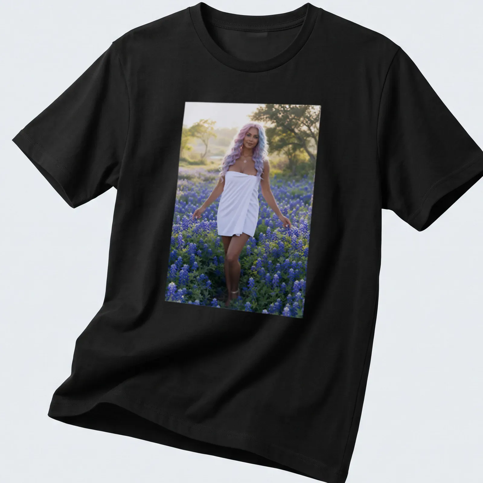 Photographic T-shirt featuring a woman in white dress among bluebonnet flowers — printed on a unisex t-shirt