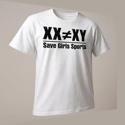Bold distressed text graphic stating 'XX ≠ XY Save Girls Sports' in black and white — printed on a unisex t-shirt (angled view)