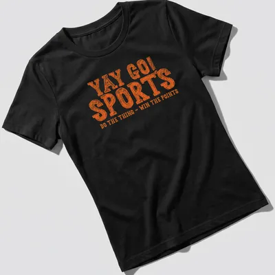 Bold distressed print of YAY GO SPORTS with sports-themed graphics in orange and white — printed on a women's shirt